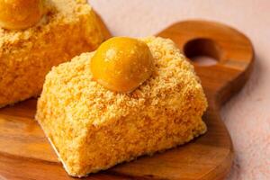 Nastar Cake is vanilla sponge based with crumbs, layered by pineapple jam and cheese cream. Topping with nastar cookies crumbs photo