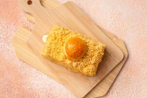 Nastar Cake is vanilla sponge based with crumbs, layered by pineapple jam and cheese cream. Topping with nastar cookies crumbs photo