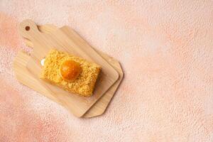 Nastar Cake is vanilla sponge based with crumbs, layered by pineapple jam and cheese cream. Topping with nastar cookies crumbs photo