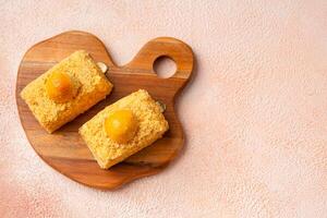 Nastar Cake is vanilla sponge based with crumbs, layered by pineapple jam and cheese cream. Topping with nastar cookies crumbs photo