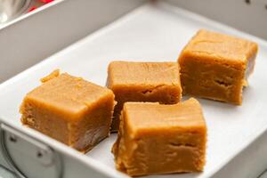 Mooncake making process. A mooncake is a Chinese bakery product traditionally eaten during the Mid Autumn Festival. photo