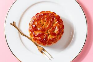 A mooncake is a Chinese bakery product traditionally eaten during the Mid-Autumn Festival. photo