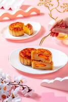 A mooncake is a Chinese bakery product traditionally eaten during the Mid-Autumn Festival. photo