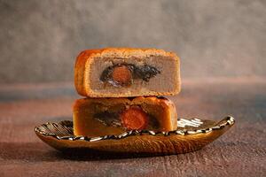 A mooncake is a Chinese bakery product traditionally eaten during the Mid-Autumn Festival. photo