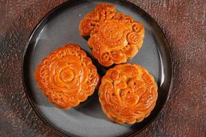A mooncake is a Chinese bakery product traditionally eaten during the Mid-Autumn Festival. photo
