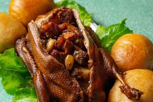 Teo Chew Braised Duck with ingredients such as Roasted Pork, Chinese Sausage, Salted Egg York, Ginko nut, Mushroom inside the duck photo