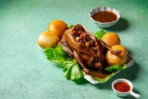 Teo Chew Braised Duck with ingredients such as Roasted Pork, Chinese Sausage, Salted Egg York, Ginko nut, Mushroom inside the duck photo