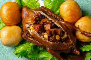 Teo Chew Braised Duck with ingredients such as Roasted Pork, Chinese Sausage, Salted Egg York, Ginko nut, Mushroom inside the duck photo