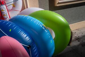 Beach floats on display for sale in a seaside village photo