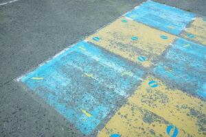 game board painted on the floor of a school playground, back to school concept photo