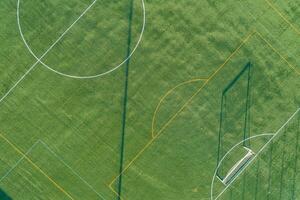 zenithal aerial view of a artificial grass football field photo
