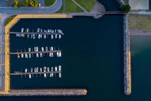 aerial top view of several boats docked at a marina photo