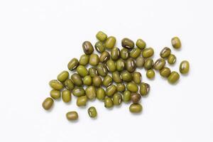 Top view of green mung beans on white background, mung beans seeds photo