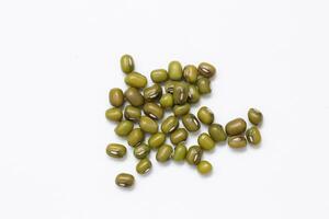 Top view of green mung beans on white background, mung beans seeds photo