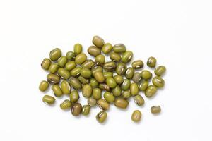 Top view of green mung beans on white background, mung beans seeds photo