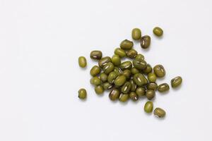 Top view of green mung beans on white background, mung beans seeds photo