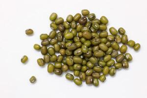 Top view of green mung beans on white background, mung beans seeds photo