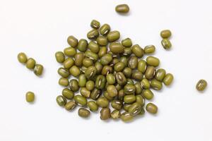 Top view of green mung beans on white background, mung beans seeds photo