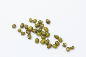 Top view of green mung beans on white background, mung beans seeds photo