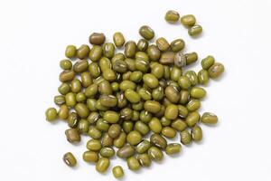 Top view of green mung beans on white background, mung beans seeds photo