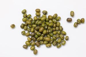 Top view of green mung beans on white background, mung beans seeds photo
