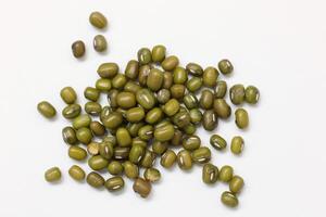 Top view of green mung beans on white background, mung beans seeds photo