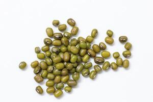 Top view of green mung beans on white background, mung beans seeds photo
