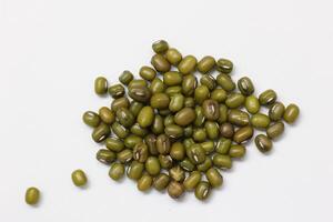 Top view of green mung beans on white background, mung beans seeds photo