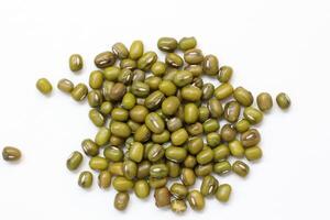 Top view of green mung beans on white background, mung beans seeds photo