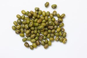 Top view of green mung beans on white background, mung beans seeds photo