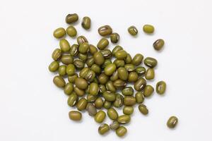Top view of green mung beans on white background, mung beans seeds photo