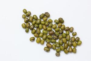 Top view of green mung beans on white background, mung beans seeds photo