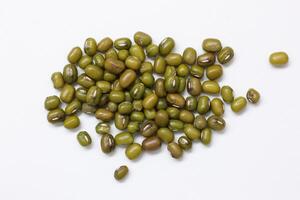 Top view of green mung beans on white background, mung beans seeds photo