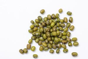 Top view of green mung beans on white background, mung beans seeds photo