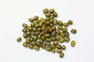 Top view of green mung beans on white background, mung beans seeds photo