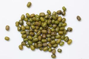 Top view of green mung beans on white background, mung beans seeds photo