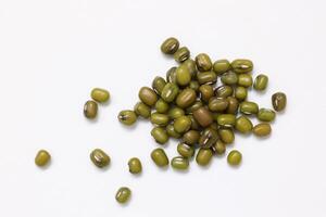 Top view of green mung beans on white background, mung beans seeds photo