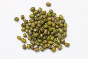 Top view of green mung beans on white background, mung beans seeds photo