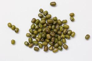 Top view of green mung beans on white background, mung beans seeds photo