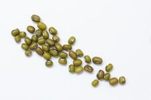 Top view of green mung beans on white background, mung beans seeds photo