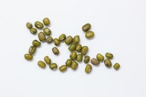 Top view of green mung beans on white background, mung beans seeds photo