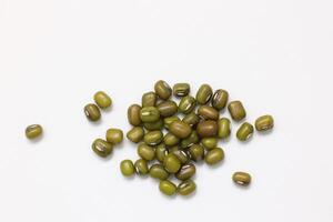 Top view of green mung beans on white background, mung beans seeds photo