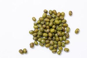 Top view of green mung beans on white background, mung beans seeds photo