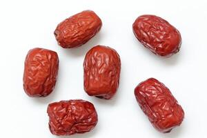 Dried fruit on white background, dried jujube on white background photo
