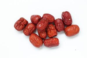Dried fruit on white background, dried jujube on white background photo