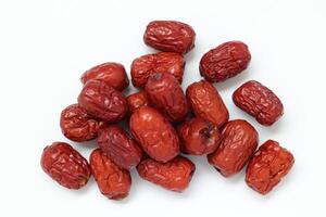 Dried fruit on white background, dried jujube on white background photo