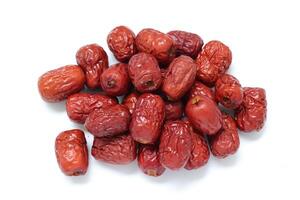 Dried fruit on white background, dried jujube on white background photo