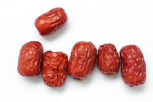 Dried fruit on white background, dried jujube on white background photo