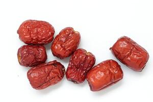 Dried fruit on white background, dried jujube on white background photo