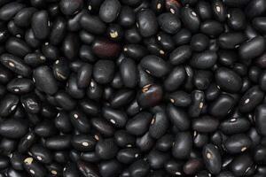 Black beans, top view of black beans seeds background photo